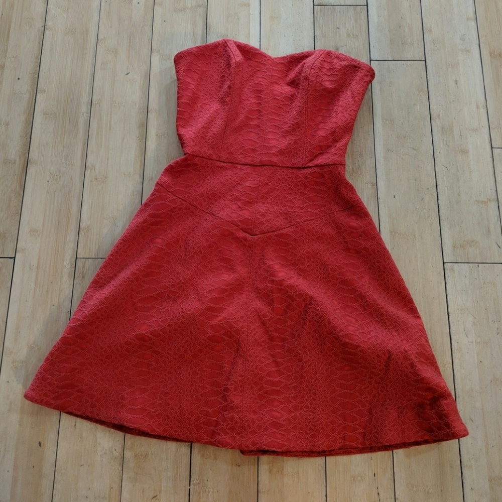 Red strapless Bebe sweetheart neck cocktail dress